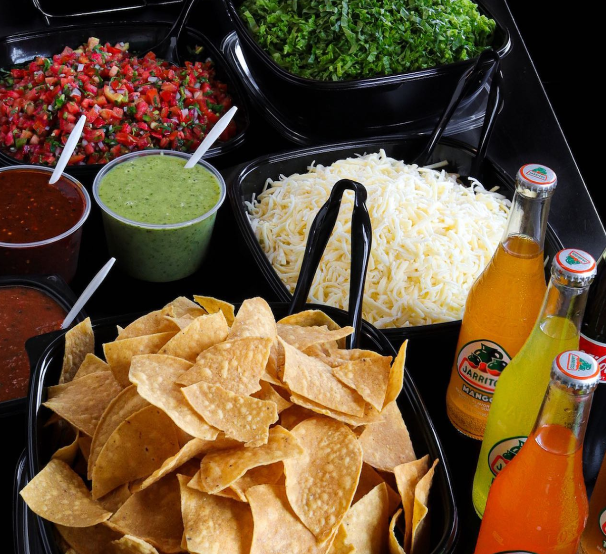 Taco bar setup with fresh ingredients